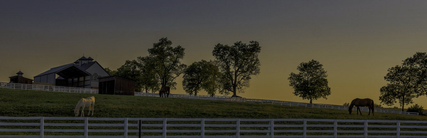 Metro Title Kentucky white fence around farm at dusk